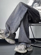 Men’s vintage wash loose fit dark-wash denim jeans with relaxed straight-leg cut and visible stitching details