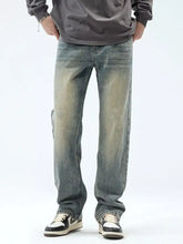 Distressed blue denim men’s vintage wash loose fit jeans with faded vintage wash and straight-leg cut