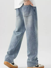 Men’s vintage wash loose fit light-wash denim jeans with relaxed straight-leg cut and classic back pockets viewed from back