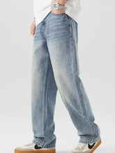 Men’s vintage wash loose fit light-wash denim jeans with a relaxed straight-leg cut and subtle fading for casual wear