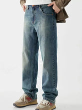 Men’s vintage wash loose fit blue denim jeans with washed fabric and subtle fading for a relaxed style