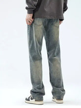 Men’s vintage wash loose fit jeans in washed denim with a faded distressed look and straight-leg cut