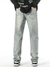 Men’s vintage wash loose fit jeans in light-wash denim with relaxed fit and classic back pockets shown from the back