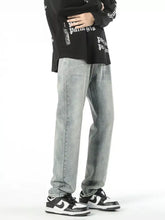 Men’s vintage wash loose fit light-wash denim jeans with straight-leg cut and subtle fading in a casual style