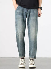 Men’s vintage wash relaxed fit jeans light-wash denim with a relaxed fit straight-leg cut and rolled cuffs