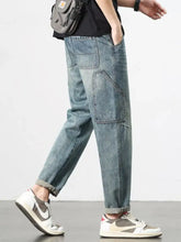 Men’s vintage wash relaxed fit jeans light-wash denim cargo pants with multiple pockets and rolled cuffs