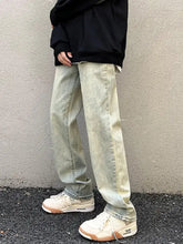 Men’s vintage wash straight leg jeans in light-wash denim with a relaxed, straight-leg cut and subtle fading