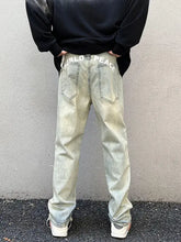 Men’s vintage wash straight leg light-wash denim jeans with world peace embroidered on the back waistband