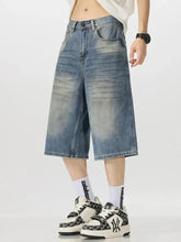 Men’s vintage wash wide-leg capris jeans in light-wash denim with faded, distressed look and wide legs