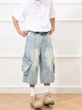 Men’s vintage wash wide-leg capris jeans in light-wash denim with large side pockets and relaxed fit cargo style