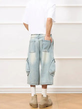 Men’s vintage wash wide-leg capris jeans in light-wash denim with multiple cargo pockets and a relaxed fit