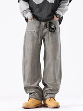 Men’s vintage wash wide leg jeans in gray denim with relaxed fit drawstring waist and large front pockets