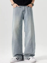 Men’s vintage wash wide leg denim jeans in light wash with relaxed fit and subtle fading for casual wear