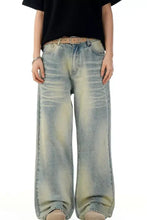 Men’s vintage wash wide leg jeans in light-wash denim with faded distressed detailing and a relaxed fit