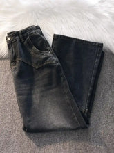 Men’s vintage wash wide leg jeans in dark wash denim with flared leg cut and classic stitching details