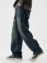 Men’s vintage wash wide leg jeans in dark-wash denim with relaxed straight-leg cut and visible stitching details