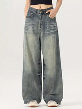 Men’s vintage wash wide leg denim jeans with faded distressed look and subtle whiskering details