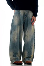 Men’s vintage wash wide leg jeans in faded blue and beige tie-dye denim with a wide leg fit