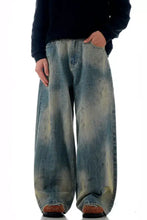 Men’s vintage wash wide leg jeans in faded blue and beige tie-dye denim with a wide leg vintage wash design