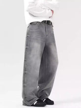 Men’s wide leg gray denim jeans with vintage wash and visible stitching in a faded wash vintage style