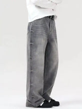 Men’s vintage wash wide leg gray denim jeans with relaxed faded wash and visible stitching details