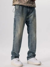 Men’s vintage wash wide leg jeans in washed blue denim with cargo pockets and reinforced stitching