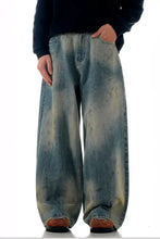 Men’s vintage wash wide leg jeans in faded blue and green tie-dye denim fabric with a wide leg fit