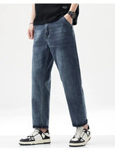 Men’s vintage washed dark-wash denim jeans with a relaxed fit straight leg and rolled cuffs