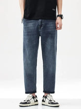 Men’s vintage washed dark-wash denim jeans with a relaxed fit straight leg and rolled cuffs for casual wear
