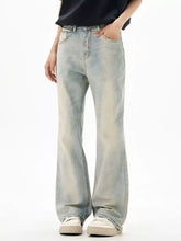Men’s wash flare jeans in light-wash denim with a relaxed wide-leg cut and subtle fading for a casual stylish look