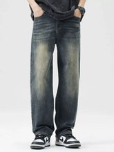Men’s dark-wash denim loose fit jeans with a faded distressed look and wide-leg cut for a casual style