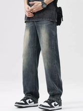 Men’s wash loose fit jeans in dark-wash denim with a relaxed straight-leg cut and subtle fading for vintage style