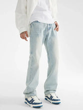 Men’s light-wash denim loose fit jeans with a straight-leg cut and subtle fading for comfortable style