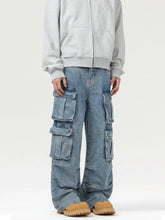 Men’s light-wash denim cargo jeans featuring a relaxed wide-leg cut and multiple large wash multi-pocket designs