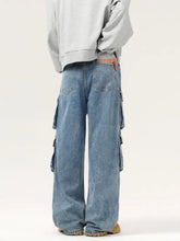 Men’s light-wash denim cargo jeans with wide legs and multiple side wash multi-pocket details for functional style