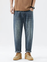 Men’s blue denim relaxed fit jeans with a relaxed fit and rolled cuffs for casual wear