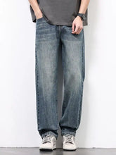 Men’s washed blue denim jeans with a relaxed fit and straight-leg cut made from soft cotton material