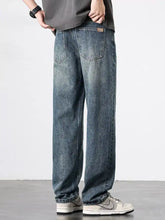 Men’s wash relaxed fit dark-wash denim jeans with a relaxed straight-leg cut and subtle fading for a casual modern look