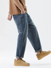 Men’s dark-wash denim relaxed fit jeans with a straight-leg cut and rolled cuffs for comfortable fit jeans style