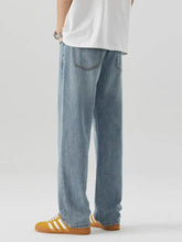 Men’s wash relaxed fit light-wash denim jeans with a relaxed straight-leg cut for casual wear
