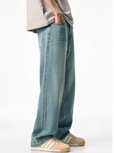 Men’s wash relaxed fit jeans in light-wash denim with a relaxed straight-leg cut for casual wear