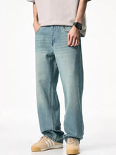 Men’s wash relaxed fit jeans in light-wash denim with a relaxed, straight-leg cut displayed from the back side