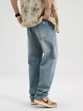 Men’s wash relaxed fit jeans in light-wash denim with a relaxed straight-leg cut and classic stitching details