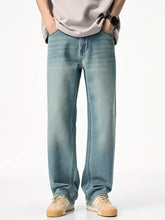 Men’s wash relaxed fit jeans in light-wash denim with a relaxed, straight-leg cut tailored for comfort