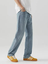 Men’s light-wash denim jeans with a relaxed fit and straight-leg cut for casual wear