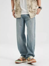 Men’s wash relaxed fit jeans in light-wash denim with a relaxed, straight-leg cut shown from the front