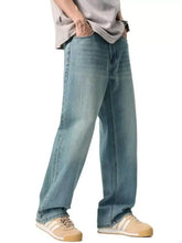Men’s wash relaxed fit jeans in light-wash denim with relaxed straight-leg cut and visible stitching details