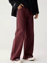 Men’s maroon wide leg denim pants with a relaxed fit and raw hem for casual wear