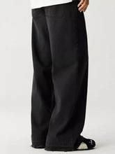 Men’s black wide leg denim jeans with relaxed fit and raw hem for casual wear