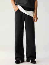 Men’s black denim jeans with relaxed fit wide leg and subtle stitching details for casual wear